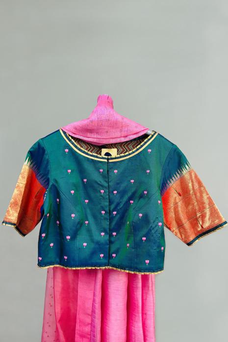 Teal blue coloured Pichwai hand handpainted blouse crafted from luxurious paithani silk fabric.