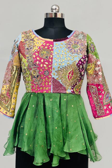 Multi coloured Hand embroidered Peplum crafted from silk & Organza fabrics.
