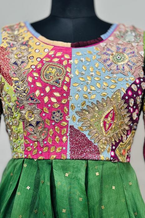 Multi coloured Hand embroidered Peplum crafted from silk & Organza fabrics.