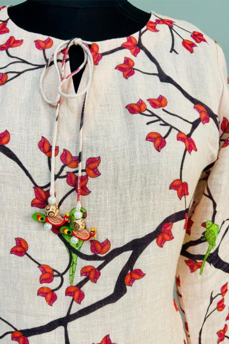 Peach coloured print pichwai linen fabric Tunic featuring Intricate Pichwai Motifs