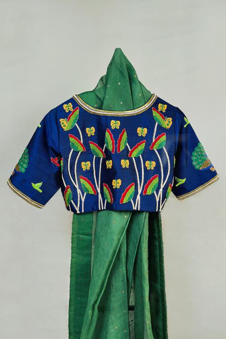 Blue coloured Pichwai hand emroidered blouse crafted from luxurious raw silk fabric.