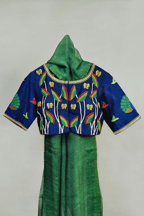 Blue coloured Pichwai hand emroidered blouse crafted from luxurious raw silk fabric.