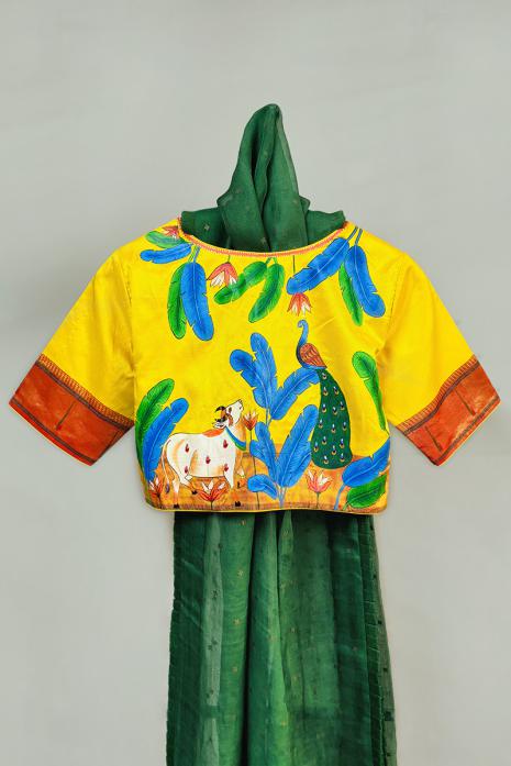Yellow coloured Pichwai hand handpainted blouse crafted from luxurious paithani silk fabric.