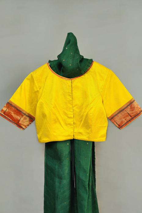 Yellow coloured Pichwai hand handpainted blouse crafted from luxurious paithani silk fabric.