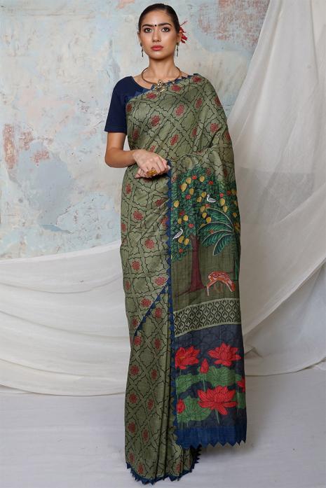 A handwoven tussar linen fabric saree in khakee colour with a beautiful intricate print featuring traditional Pichwai motifs.