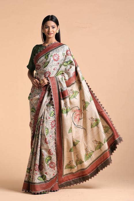 A handwoven tussar linen fabric saree in beige colour with a beautiful intricate print featuring traditional Pichwai motifs.